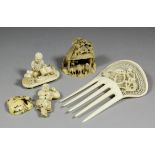 A small Japanese carved ivory okimono depicting figures building a small thatched house, 2.125ins (