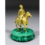 20th Century Russian School - Gilt bronze figure of a Cossack on horseback, on turned malachite