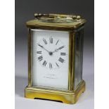 A late 19th/early 20th Century French carriage clock retailed by Jas. Shoolbred & Co, the white