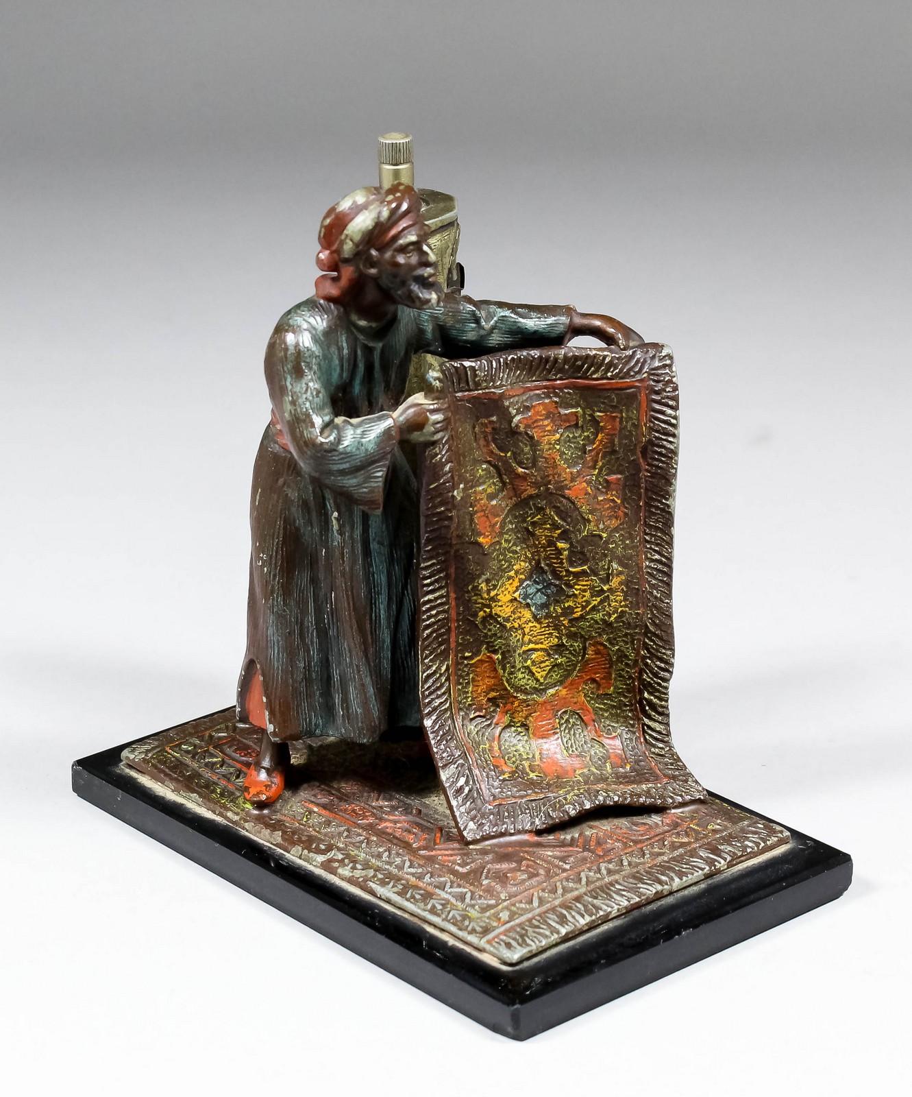 An early 20th Century Continental painted spelter table lamp modelled in the form of an Arab