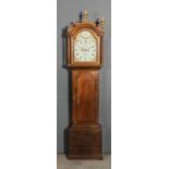 An early 19th Century oak longcase clock by Lepine of Canterbury, the 12ins arched painted dial with