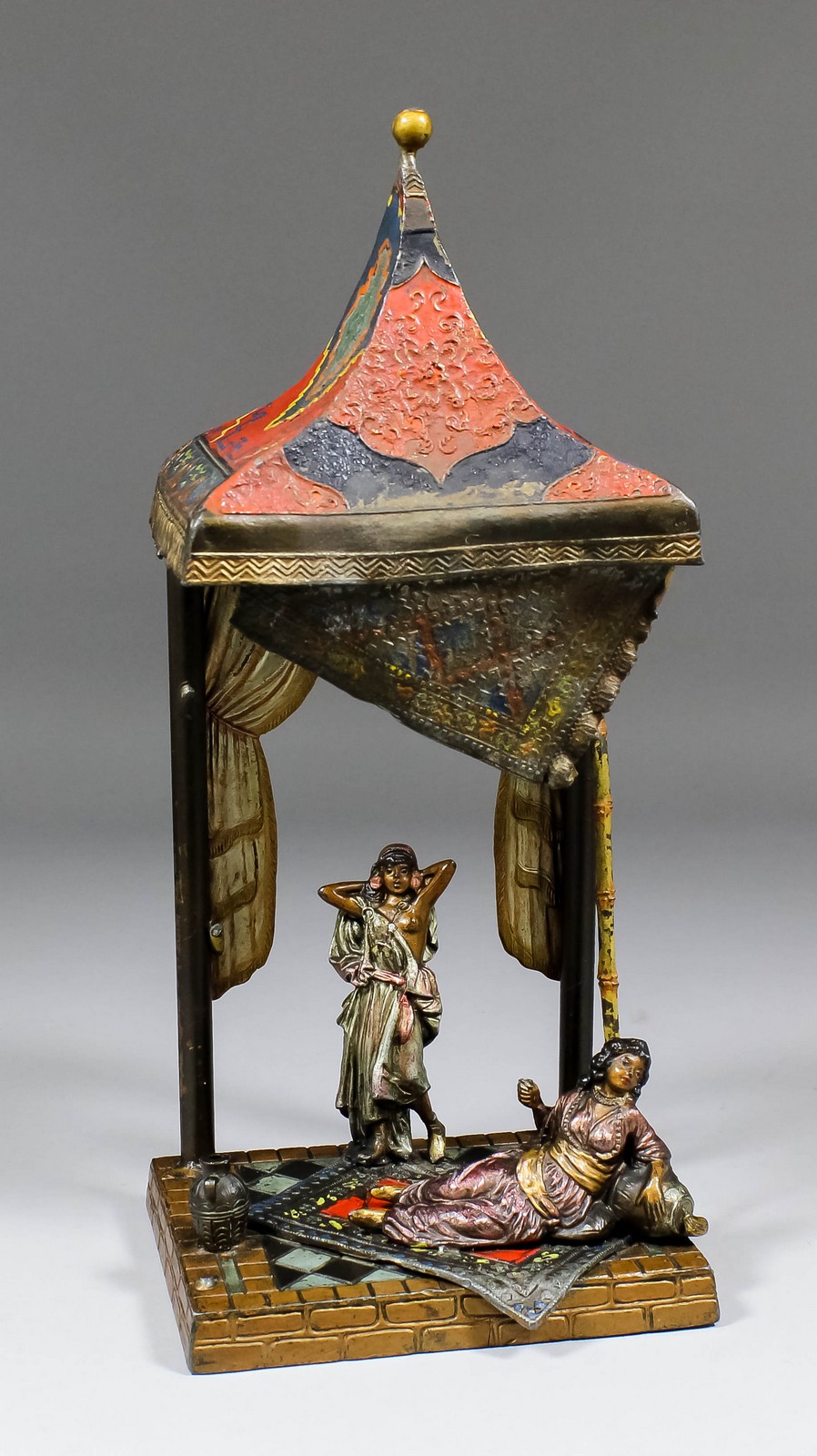 An early 20th Century painted spelter electric table lamp modelled in the form of two Eastern ladies