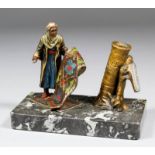 An early 20th Century Continental painted spelter table lighter modelled in the form of an Arab