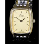 A modern lady's stainless steel and gilt metal Omega de Ville wristwatch, the gilt dial with baton