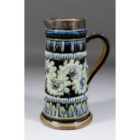 A late 19th Century Doulton Lambeth stoneware lemonade jug by George Tinworth with raised and