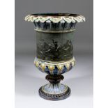 A late 19th Century Doulton Lambeth stoneware Campana shaped vase by Frank Butler, the central panel