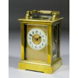 An early 20th Century French carriage clock, the 2.25ins diameter cream enamelled chapter ring