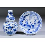 A Chinese blue and white porcelain double gourd shaped vase painted with flowers, butterflies and