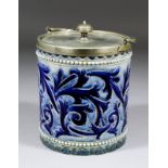 A late 19th Century Doulton Lambeth stoneware biscuit barrel with plated mount and lid decorated