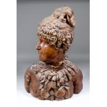 A 19th Century Continental carved pear wood life sized portrait bust of a young woman with