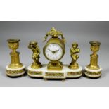 A late 19th/early 20th Century French ormolu and white marble cased three piece clock garniture of