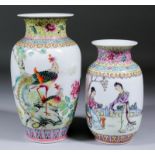 A Chinese porcelain vase enamelled in colours with two Phoenix perched on a rock and with peonies