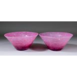 A pair of pink mottled Monart glass bowls, each 8ins diameter x 3.75ins high (ground pontil marks)