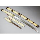 A Japanese Wakizashi in carved bone scabbard, with 18.5ins (470mm) blade, 33ins (838mm) overall, and