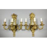 A pair of late 19th Century French gilt brass three branch electric wall lights of 18th Century
