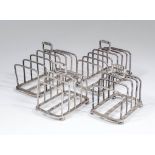 A pair of George V silver rectangular six division toast racks on bun feet, each 5.25ins x 6.