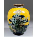 A Japanese cloisonne enamel bulbous vase decorated with chrysanthemums on a sand coloured and dark