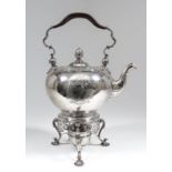 A good George II silver circular tea kettle and stand with spirit lamp, the kettle with plain