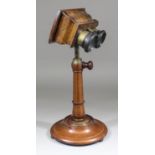 A late 19th Century mahogany and walnut veneered table stereoscopic viewer by Pickard & Curry, on