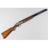 A 12 bore over and under shotgun by Caesar Guerine, Essex model, 30ins  blacked barrels with full