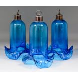 Three blue glass shades with bronzed metal fittings and rings for suspension, each 12ins high