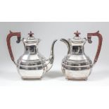 An Elizabeth II silver rectangular coffee pot of panelled form with wooden angular handle and on bun