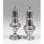 An early George III silver urn pattern pepper pot, the pierced domed cover with spiral finial and