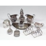 An Edward VII silver oval boat shaped inkstand (to hold one oval inkwell) with pierced sides and