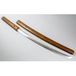 A Japanese Wakizashi in Shirasaya, the 21ins polished blade with visible hamon, signed "