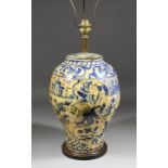 An Isnick blue and white pottery baluster shaped vase, painted with two huntsman on horseback,