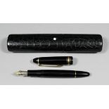 A Mont Blanc "Meisterstuck No. 146" black fountain pen with two tone nib and Mont Blanc star to cap,