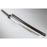 A Japanese Katana, the 25ins polished blade with some original hamon, the cast iron Tsuba pierced