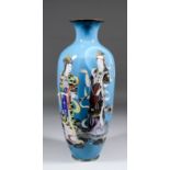 A Japanese cloisonne enamel slender baluster shaped vase enamelled in colours with a standing figure