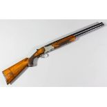 A 12 bore over and under shotgun by Miroku, 26ins blued barrels with raised rib and bead sights,