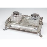 An Edward VII silver rectangular inkstand of early 18th Century design with shaped and pierced