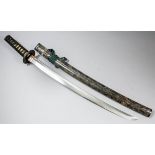 A Japanese Wakizashi, the 20.5ins polished blade with visible cloud hamon, unsigned, the cast iron