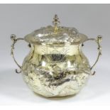 A good Charles II silver gilt circular two-handled porringer and cover, the bulbous body with cast