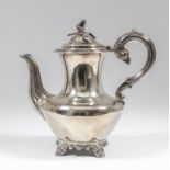 A Victorian silver coffee pot with bulbous base, acorn pattern finial, reeded handle and spout, on