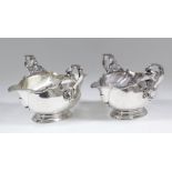 A pair of George V silver oval double lipped and double handled sauce boats of early 18th Century