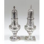 A George III silver urn pattern pepper pot, the pierced domed cover with turned finial, the body