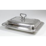 A George V silver rectangular entree dish and cover with French gadroon mounts and angular handle,