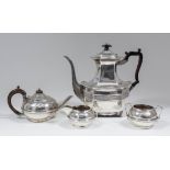 A late Victorian silver coffee pot of octagonal panelled form, the serpentine rim with gadroon