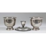 Two Continental silvery metal circular bowls with turned over rims, each engraved with a crest and