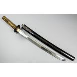 A Japanese Wakizashi the 17ins polished blade with visible hamon, unsigned, the Tsuba applied with