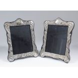 A pair of George IV silver rectangular photograph frames in the Art Nouveau manner, the shaped