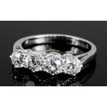 A modern platinum mounted four stone diamond ring, the brilliant cut stones each approximately .33ct