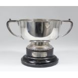 A George V silver circular two-handled trophy with angular handles, on circular footrim with bead