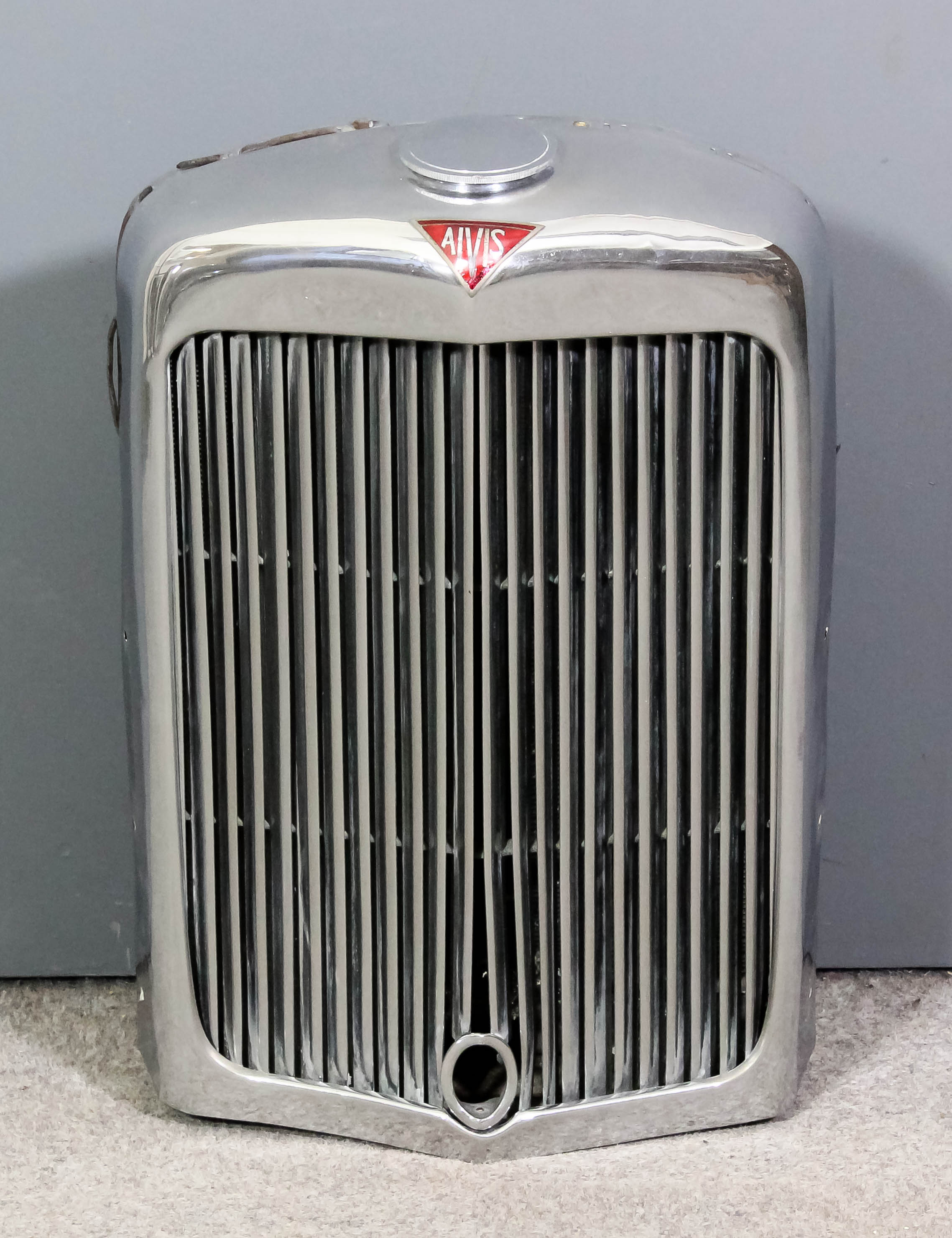 A 1940's Alvis radiator and cap with grille, the radiator with plaque ...