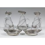 Three George V clear glass and silver mounted whisky noggins, 4.25ins high, Birmingham 1926, three