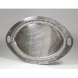 A late Victorian silver oval two handled tray with gadroon ornament to inner rim, 24ins x 16ins